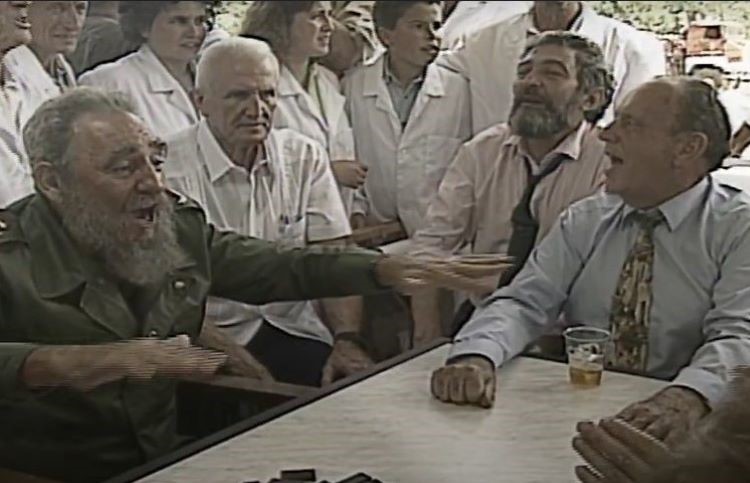 Fidel Castro and Manuel Fraga are about to play dominoes