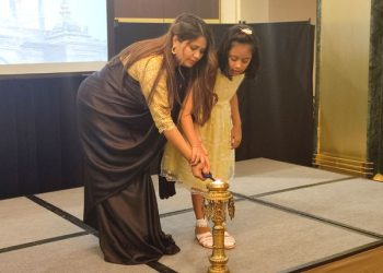 Nepalese Ambassador Sher Bahadur Deuba, together with her daughter, lighting the pancakes. /Photos: JDL.